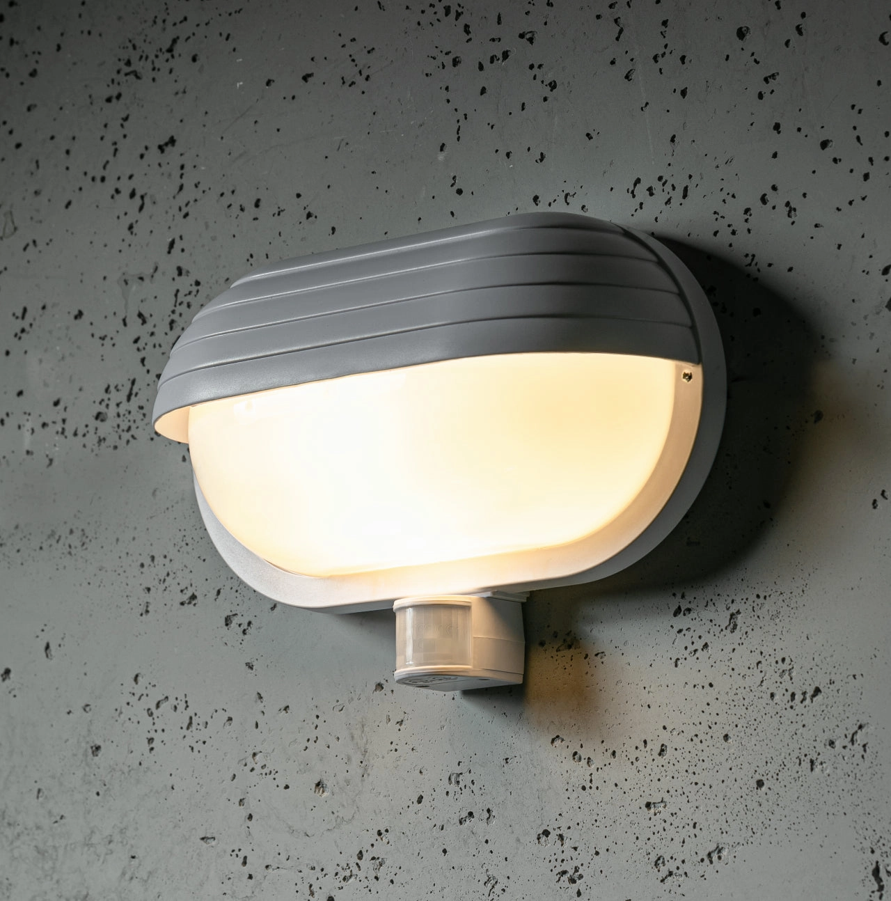 CGC VESPA White Oval Eyelid Bulkhead Wall Light With Motion SensorWeatherproof outdoor lighting